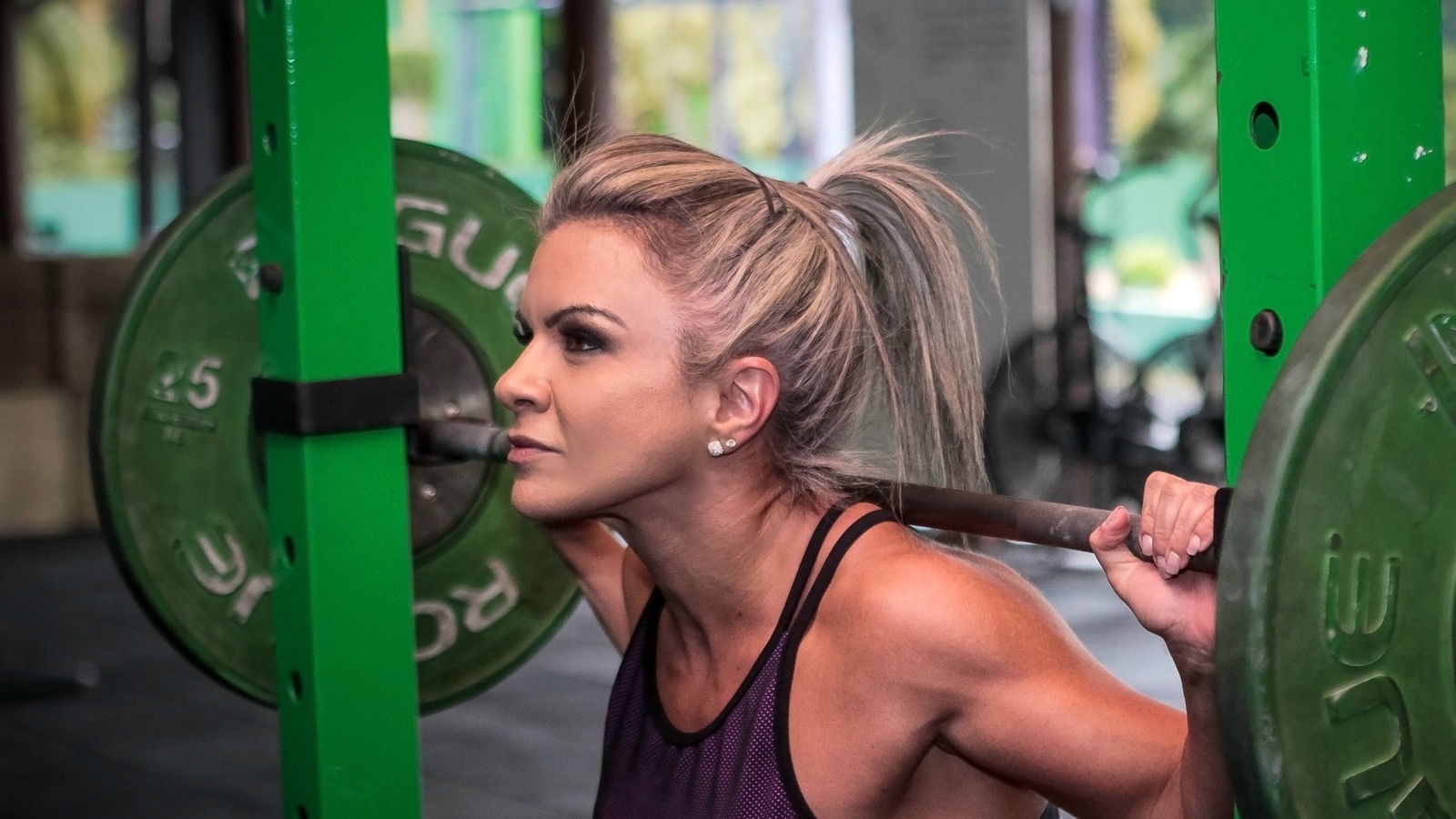 A woman preparing to lift weights