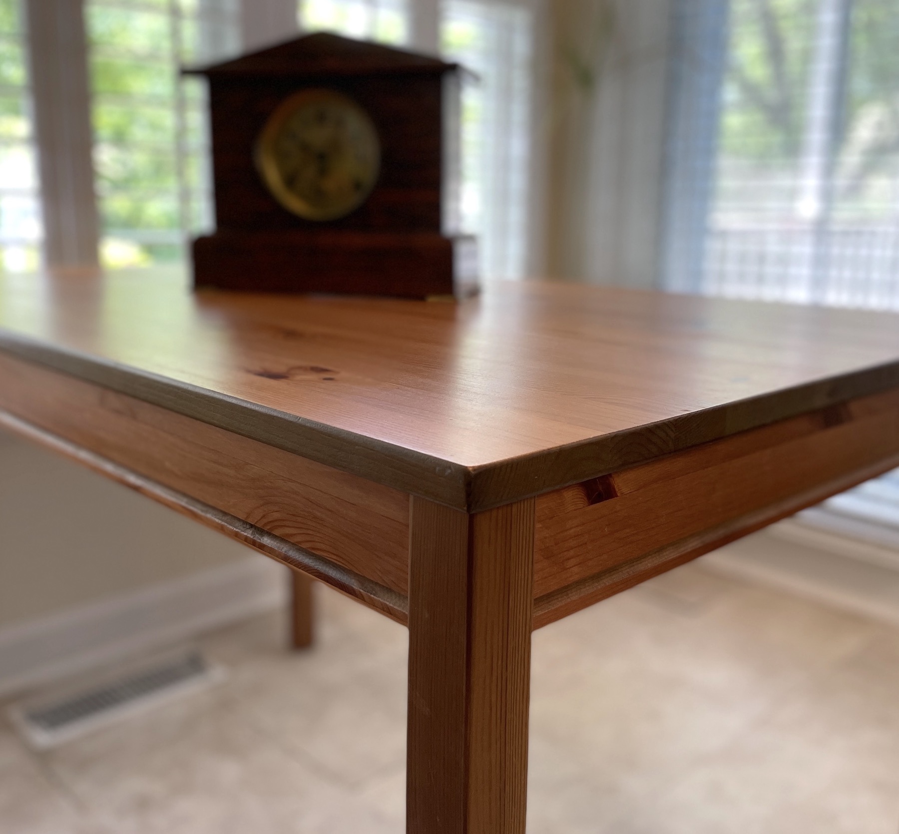 A table with a clock on top of it